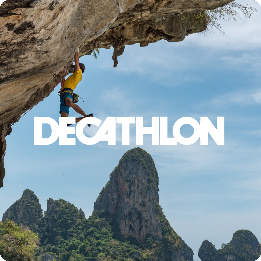A men climbing with DECATHLON written in uppercase letter in front of it